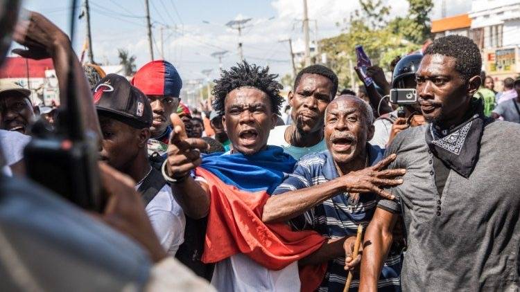 Haitians fear democracy is slipping away; thousands are taking to the streets protesting