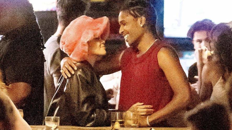 Rihanna and A$AP Rocky share a kiss during Arcade date night