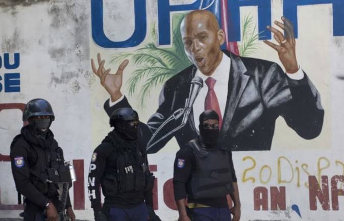Haitian police hunt down the President's assassins as uncertainty grows