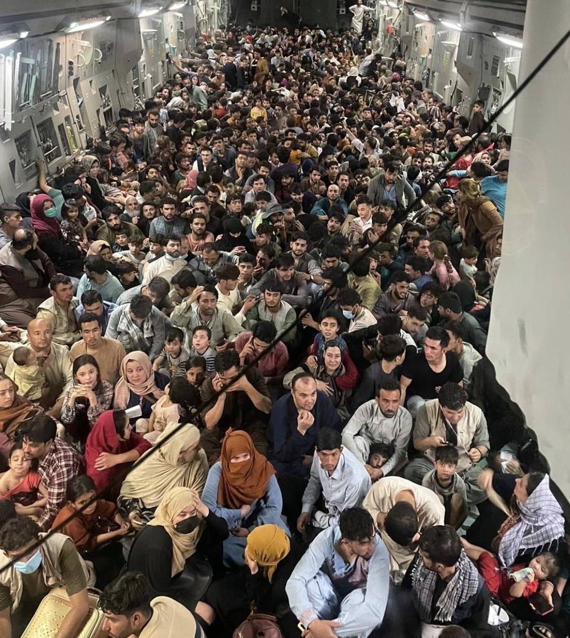 Surprising photos show 640 Afghans packed into fleeing US Air Force plane