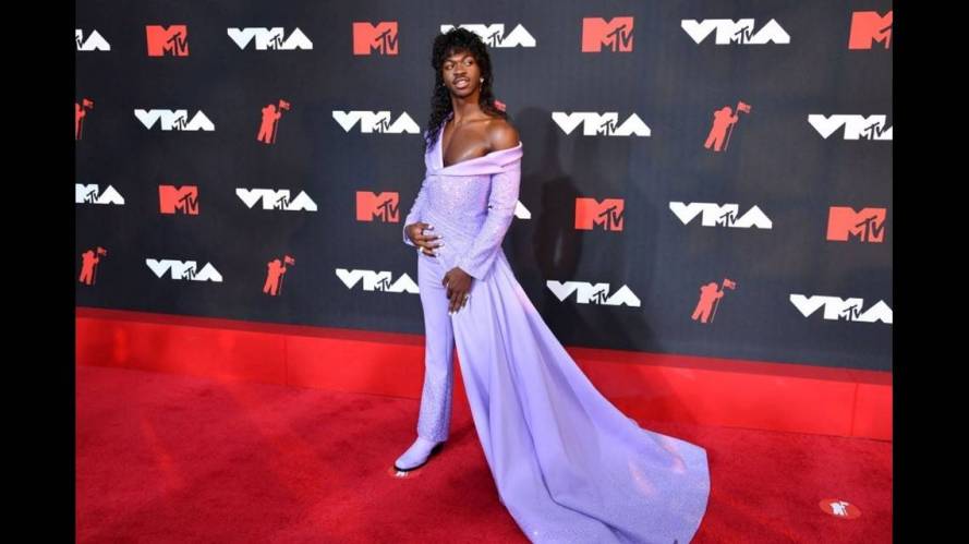 Lil Nas X Teases 'Sexy' 2021 MTV VMAs Performance While Slaying Red Carpet In a Purple Cape
