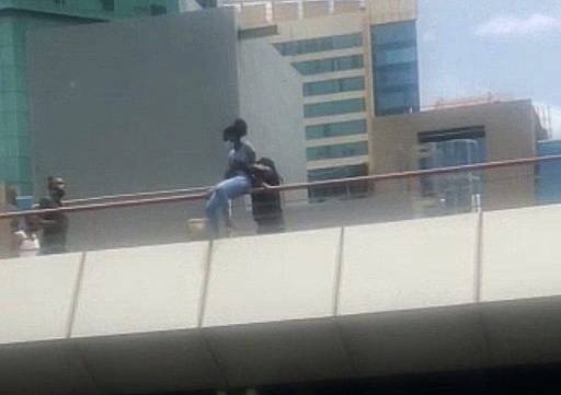 T&T: Police stop girl from jumping off Parkade