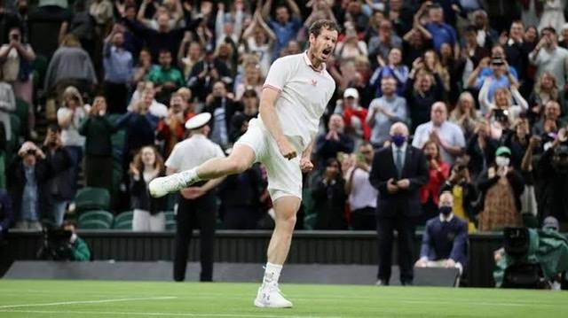 Britain's Andy Murray knocked out in the second round by John Isner at Wimbledon
