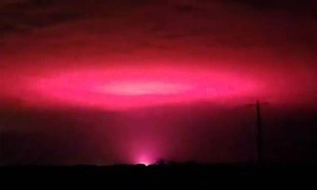 A mysterious pink glow in the sky confuses Australian town and outs cannabis farm