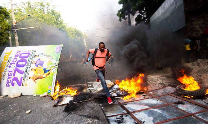 Haitian citizens block streets in Port-au-Prince after fuel price hike