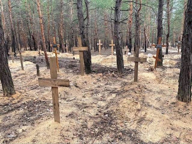 Almost 440 graves found at Izium burial site, Ukraine says