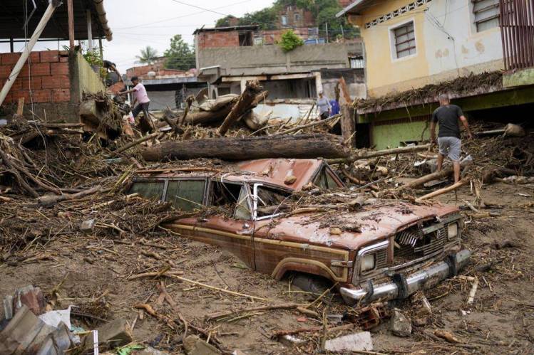 Rain-fueled landslide sweeps through Venezuela town; 22 dead