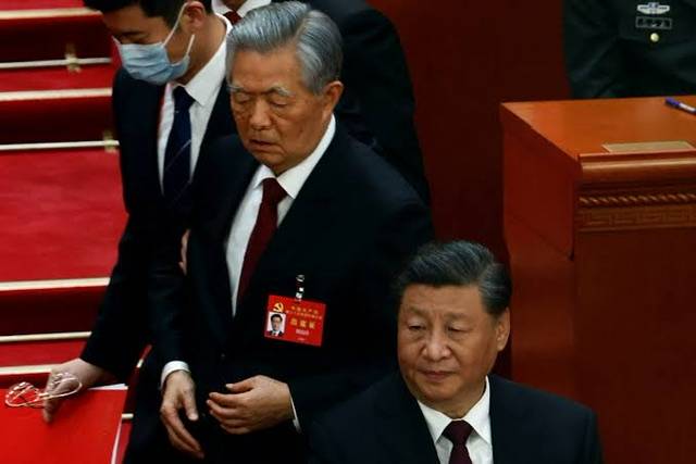 Former president Hu Jintao escorted out of the China party congress