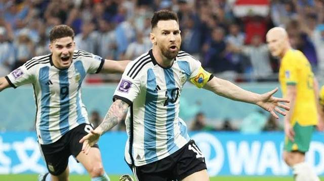 Argentina 2-1 Australia: Messi scores in his 1,000th game and reaches World Cup final eight
