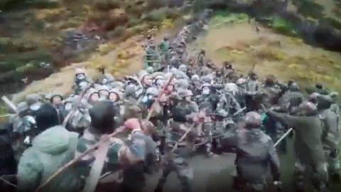 Chinese and Indian troops fight with sticks and bricks in a video