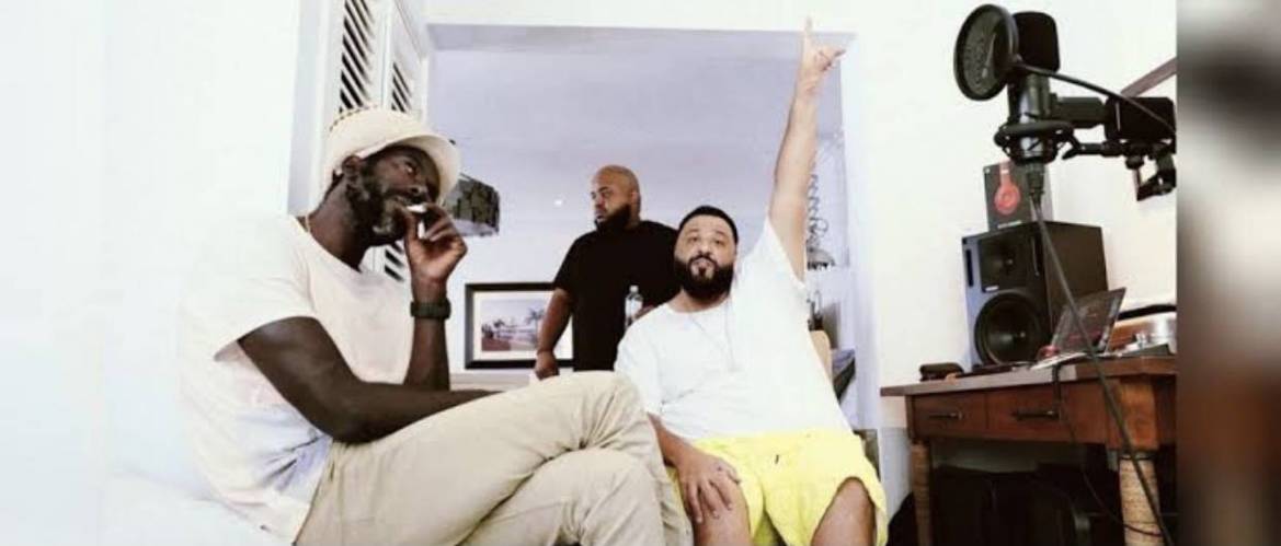 Buju Banton poses, shows off his plaques from DJ Khaled