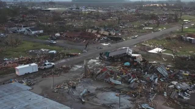 At least 23 dead and dozens of people are still trapped in Mississippi by a tornado