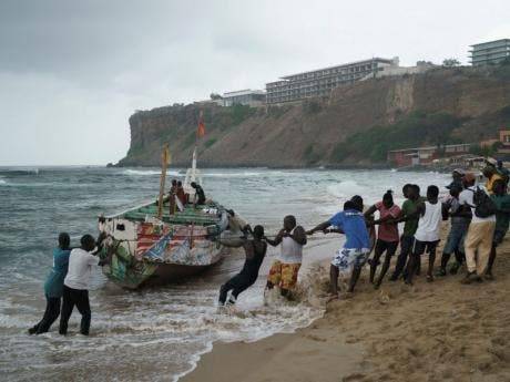 At least 17 bodies recovered after a migrant boat capsized off Senegal's capital city