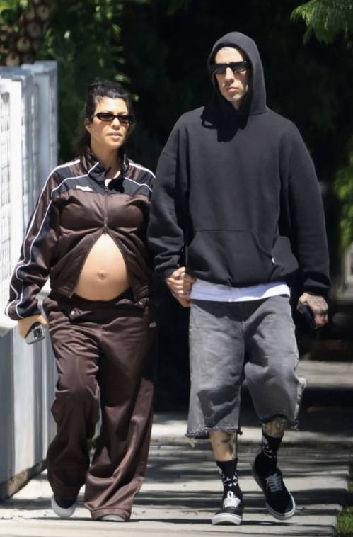 Pregnant Kourtney Kardashian Bares Her Baby Bump in Tracksuit
