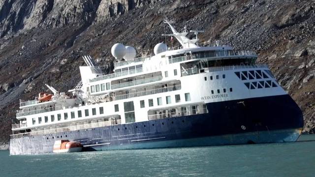 A luxury cruise ship pulled free in Greenland after three days stuck in mud