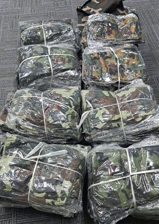 Guyanese national detained, police seize thousands of camouflage items