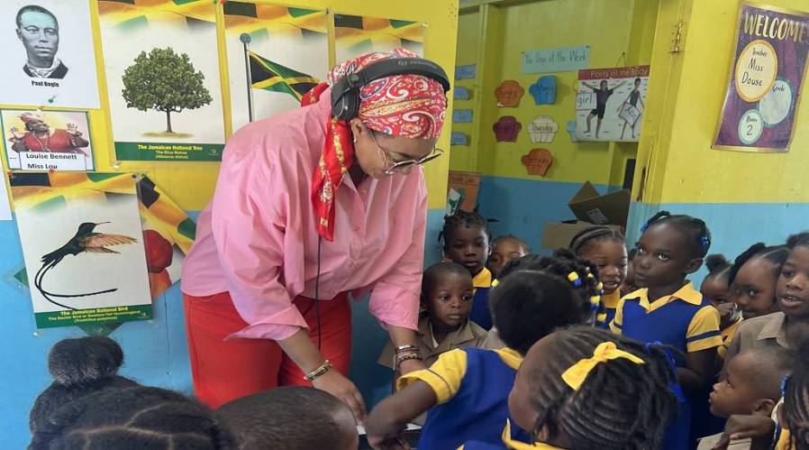 DJ Sunshine spreads cheer, gifts to children at Stony Hill school